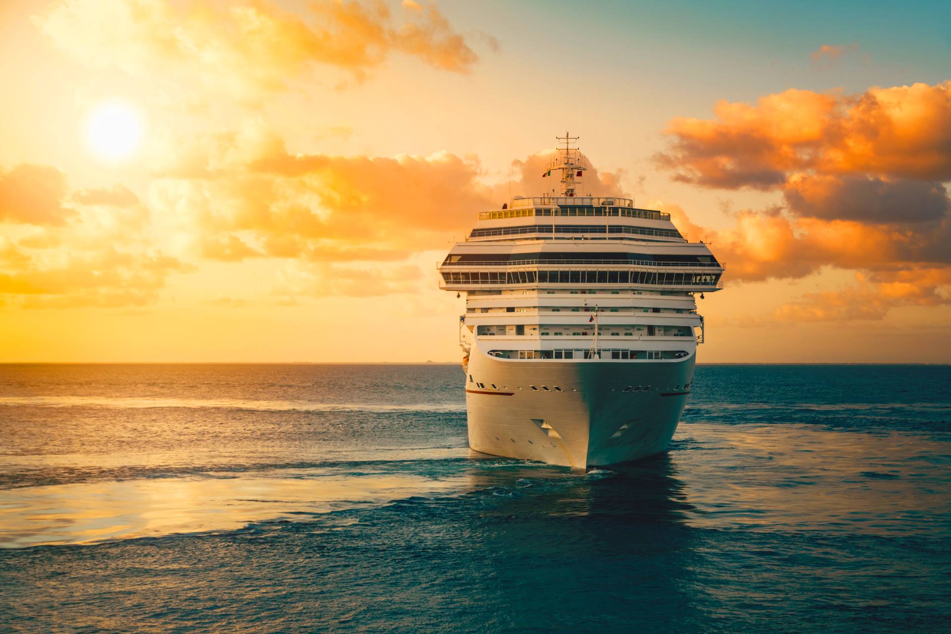 Cruise ship on the ocean during sunset