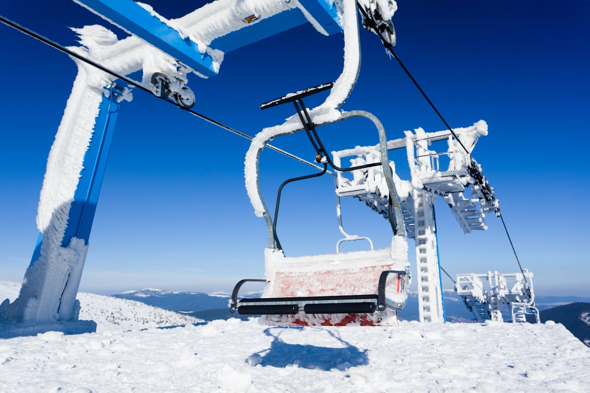 Ski lift covered in ice and snow